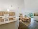 Bright kitchen with wood cabinetry, modern appliances, and an adjacent dining area with backyard access at 2353 Kingscrest Cir, Apopka, FL 32712