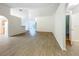 Open-concept living room with wood-look floors and a view of the backyard at 2353 Kingscrest Cir, Apopka, FL 32712