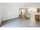 Open-concept living space with plenty of natural light and a view of the kitchen at 2353 Kingscrest Cir, Apopka, FL 32712