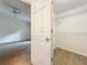 This is a walk-in closet with wooden floors, white walls, and plenty of adjustable shelving at 2353 Kingscrest Cir, Apopka, FL 32712