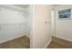 Walk-in closet with metal shelves and rods for organizing clothes and storage space at 2353 Kingscrest Cir, Apopka, FL 32712