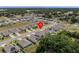 Take in the aerial view of this residential neighborhood, with its well-maintained homes and lush greenery at 253 Fiddlewood Ct, Davenport, FL 33837