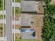 Aerial view of the property showing the layout of the house and surrounding yard at 253 Fiddlewood Ct, Davenport, FL 33837