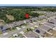 Discover a serene neighborhood from an aerial perspective, featuring well-maintained homes and lush greenery at 253 Fiddlewood Ct, Davenport, FL 33837