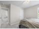 Bedroom with a bed and access to another room, creating a comfortable and accessible layout at 253 Fiddlewood Ct, Davenport, FL 33837