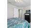 Bedroom featuring a black dresser with TV and closet access, providing comfort and convenience at 253 Fiddlewood Ct, Davenport, FL 33837