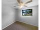 Cozy bedroom with a ceiling fan and a window for natural light at 2575 King Ave, Auburndale, FL 33823