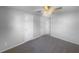 Bedroom with carpet, ceiling fan, and white trim at 2575 King Ave, Auburndale, FL 33823