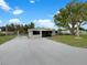 Charming single-story home featuring a screened porch, freshly painted exterior, and landscaped front yard at 2575 King Ave, Auburndale, FL 33823