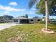 Charming single-story home featuring a screened porch, freshly painted exterior, and landscaped front yard at 2575 King Ave, Auburndale, FL 33823
