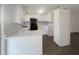Bright kitchen with stainless steel appliances, white cabinets, and solid surface countertops, offering ample space at 2575 King Ave, Auburndale, FL 33823
