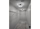 Spacious walk-in closet with carpeting and shelving, illuminated by decorative lighting at 3028 Lakes Crest Ave, St Cloud, FL 34772