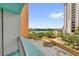 Balcony view overlooking a lake, greenery, and other buildings on a sunny day at 322 E Central Blvd # 614, Orlando, FL 32801