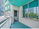 Private balcony with turquoise flooring and ceiling offers views of the city and architecture at 322 E Central Blvd # 614, Orlando, FL 32801