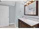Bathroom featuring a marble vanity, modern sink fixtures, and blue walls at 322 E Central Blvd # 614, Orlando, FL 32801
