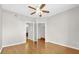 This large bedroom offers wood flooring, a ceiling fan, and access to the bathroom and closet at 322 E Central Blvd # 614, Orlando, FL 32801