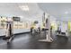 Modern gym features strength-training machines and ample natural light from large windows at 322 E Central Blvd # 614, Orlando, FL 32801