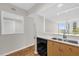 Kitchen featuring wooden cabinets, stainless steel appliances, and an opening to the living space at 322 E Central Blvd # 614, Orlando, FL 32801