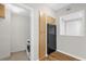 Kitchenette featuring laundry space, wooden cabinets, and black appliances at 322 E Central Blvd # 614, Orlando, FL 32801