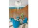 A welcoming lobby featuring modern furniture, a stylish chandelier, and an accent wall at 322 E Central Blvd # 614, Orlando, FL 32801