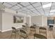 Community meeting room with ample seating and a mounted television screen at 322 E Central Blvd # 614, Orlando, FL 32801
