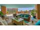 Relaxing outdoor patio features comfortable seating, a coffee table, and scenic city views at 322 E Central Blvd # 614, Orlando, FL 32801