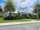 Community amenities center featuring a well-manicured lawn, lush landscaping, and convenient parking at 3458 Sagebrush St, Harmony, FL 34773
