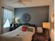 Comfortable bedroom with natural light, a decorative wall piece, and a stylish chair at 3458 Sagebrush St, Harmony, FL 34773