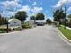 Grand community entrance with lush landscaping and a welcoming sign, 'South Lake' at 3458 Sagebrush St, Harmony, FL 34773