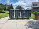 Community mailboxes neatly arranged along a paved sidewalk, adjacent to lush green landscaping at 3458 Sagebrush St, Harmony, FL 34773