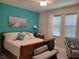 Comfortable main bedroom featuring a bright accent wall, cozy decor, and ample natural light at 3458 Sagebrush St, Harmony, FL 34773
