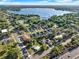 Aerial view of a neighborhood near a lake, highlighting the community and surrounding landscape at 3507 W Jefferson St, Orlando, FL 32805