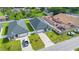Birds-eye view of two homes featuring manicured lawns and stylish gray exteriors at 3507 W Jefferson St, Orlando, FL 32805