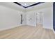 Bright bedroom with modern decor and ample natural light features a bathroom entrance and exterior door at 3507 W Jefferson St, Orlando, FL 32805