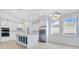 Modern kitchen with white cabinets, marble countertops, stainless steel appliances, and island at 3507 W Jefferson St, Orlando, FL 32805