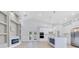 Bright, open-concept kitchen with white cabinets, island, and modern appliances at 3507 W Jefferson St, Orlando, FL 32805