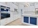 Modern kitchen with white cabinetry, stainless steel appliances, and a marble countertop island at 3507 W Jefferson St, Orlando, FL 32805