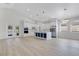 Spacious kitchen with vaulted ceiling features a large island with seating and stainless steel appliances, perfect for entertaining at 3507 W Jefferson St, Orlando, FL 32805