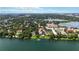 An aerial view showcases waterfront condos with community pool, private docks, and verdant surroundings at 386 Lakeview St, Orlando, FL 32804