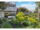 A beautifully landscaped backyard featuring lush garden, patio and relaxing pool at 386 Lakeview St, Orlando, FL 32804