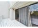 Exterior home balcony with white paint, sliding glass doors, and outdoor lantern lighting at 386 Lakeview St, Orlando, FL 32804