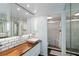 Modern bathroom with subway tile, wood counter top, and glass enclosed shower at 386 Lakeview St, Orlando, FL 32804