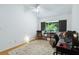 Bright bedroom with vaulted ceiling, ceiling fan, and an area rug over hardwood floors at 386 Lakeview St, Orlando, FL 32804