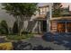 Townhome exterior featuring modern wood garage door and inviting front entryway at 386 Lakeview St, Orlando, FL 32804