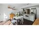 Open floor plan from eat-in area to kitchen featuring bar seating and stainless appliances at 386 Lakeview St, Orlando, FL 32804