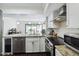Updated kitchen with granite counters, stainless appliances and seamless access to outdoor patio at 386 Lakeview St, Orlando, FL 32804