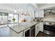 Bright kitchen featuring granite countertops, stainless steel appliances, and natural light at 386 Lakeview St, Orlando, FL 32804