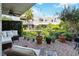 Inviting brick-paved patio with outdoor seating, lush garden and peaceful water feature at 386 Lakeview St, Orlando, FL 32804