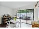 Eat-in kitchen area with sliding glass doors leading to a tiled patio with grilling area at 386 Lakeview St, Orlando, FL 32804