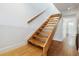 Hardwood staircase leads to the upper level, with a light-filled entryway at 386 Lakeview St, Orlando, FL 32804